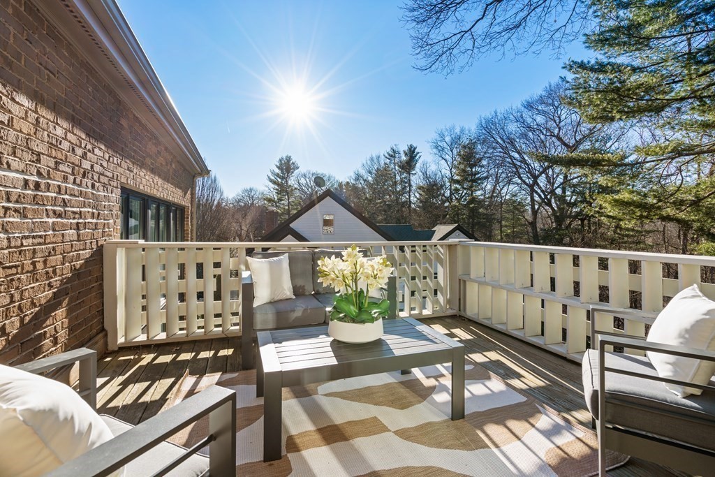9 Newbrook Circle Newton, MA 02467 - Photo 16 of 28 a view of a balcony with wooden chairs