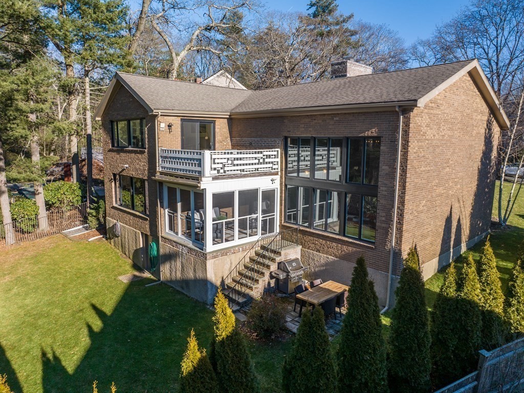 9 Newbrook Circle Newton, MA 02467 - Photo 25 of 28 a front view of a house with a yard