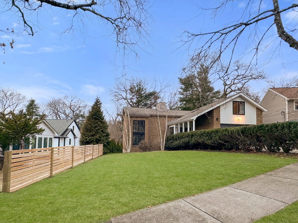 9 Newbrook Circle Newton, MA 02467 - Photo 26 of 28 a front view of house with yard and green space