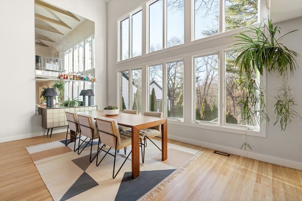 9 Newbrook Circle Newton, MA 02467 - Photo 5 of 28 a dining room with furniture large windows and wooden floor