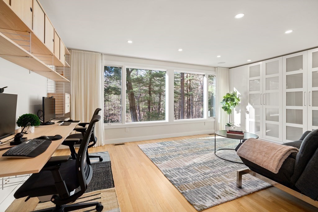 9 Newbrook Circle Newton, MA 02467 - Photo 9 of 28 a living room with furniture water view and large windows
