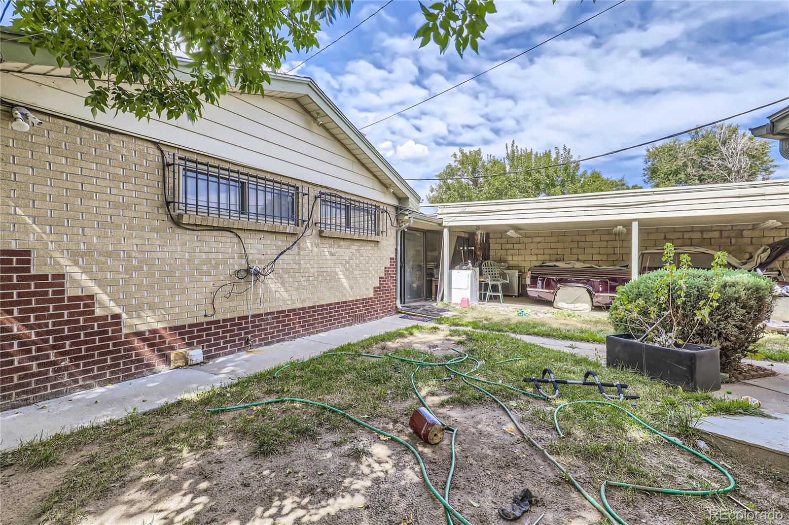 3550 Eudora Street Denver, CO 80207 - Photo 11 of 19 a front view of a house with garden