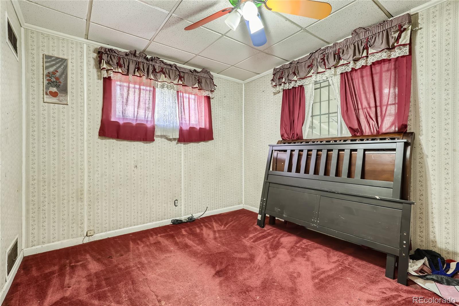 3550 Eudora Street Denver, CO 80207 - Photo 5 of 19 a bedroom with a bed and a window