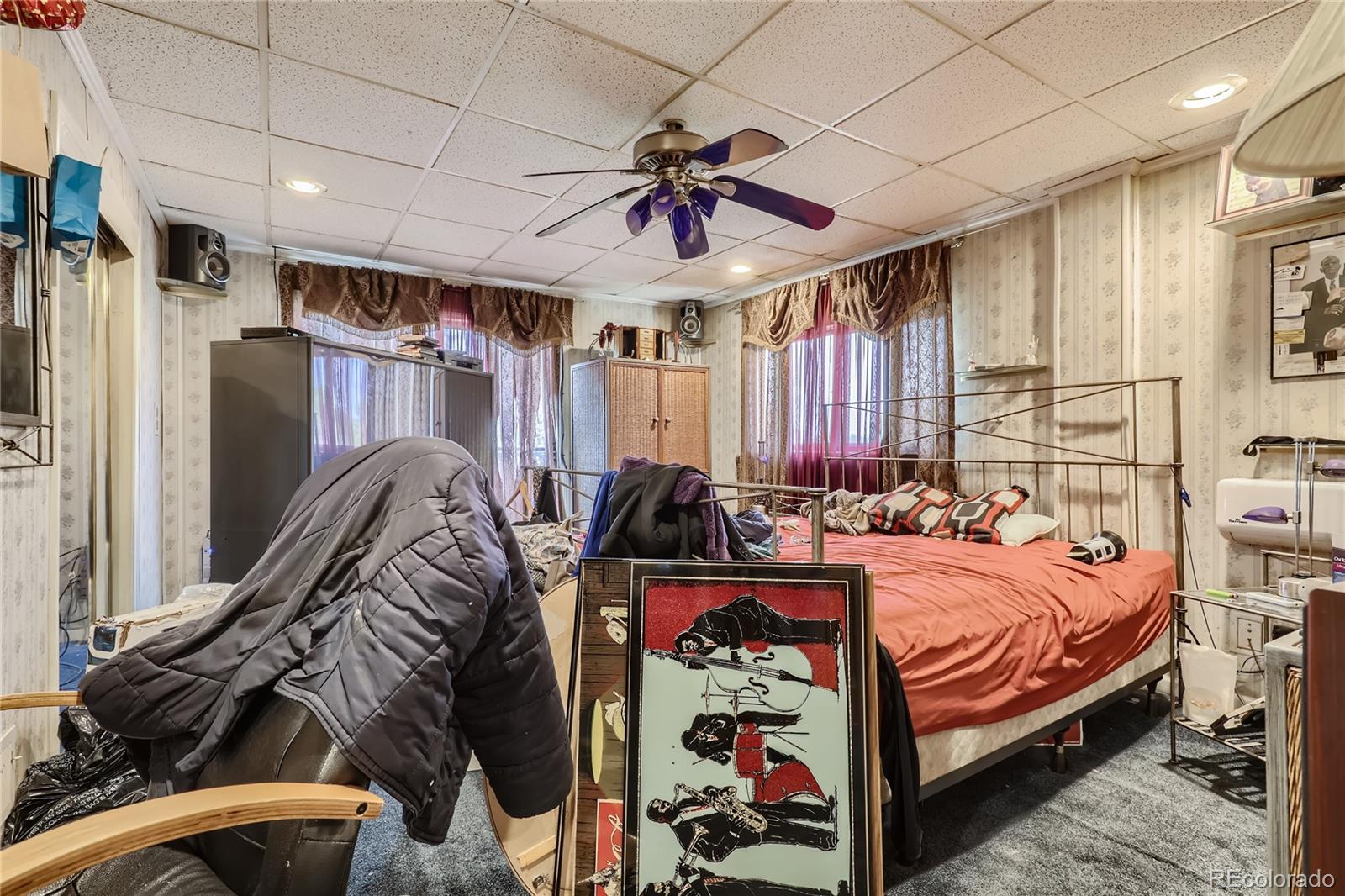 3550 Eudora Street Denver, CO 80207 - Photo 7 of 19 a bedroom with furniture and a bed