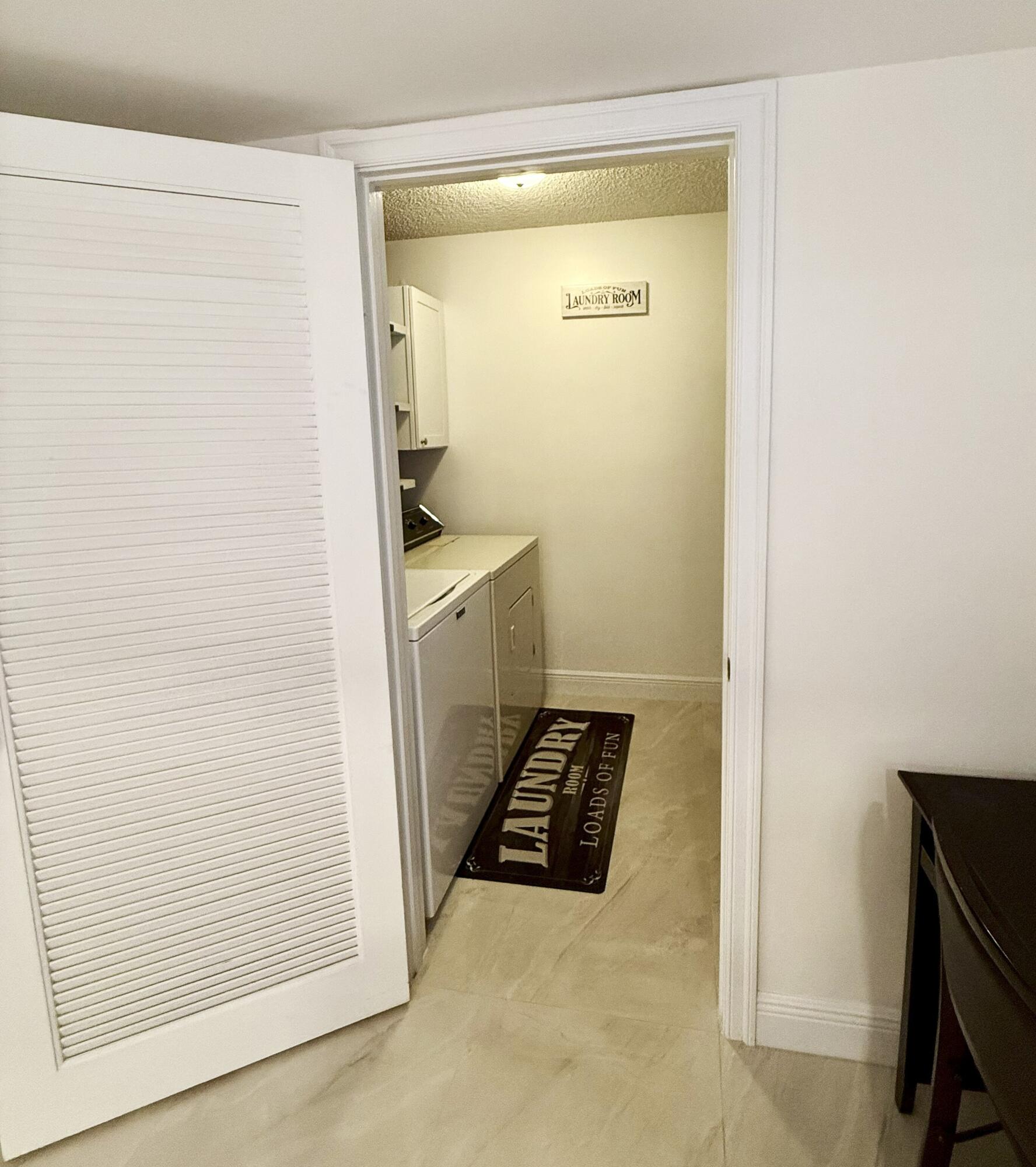 702 Wingfoot Drive, Unit D Jupiter, FL 33458 - Photo 11 of 39 Laundry Closet