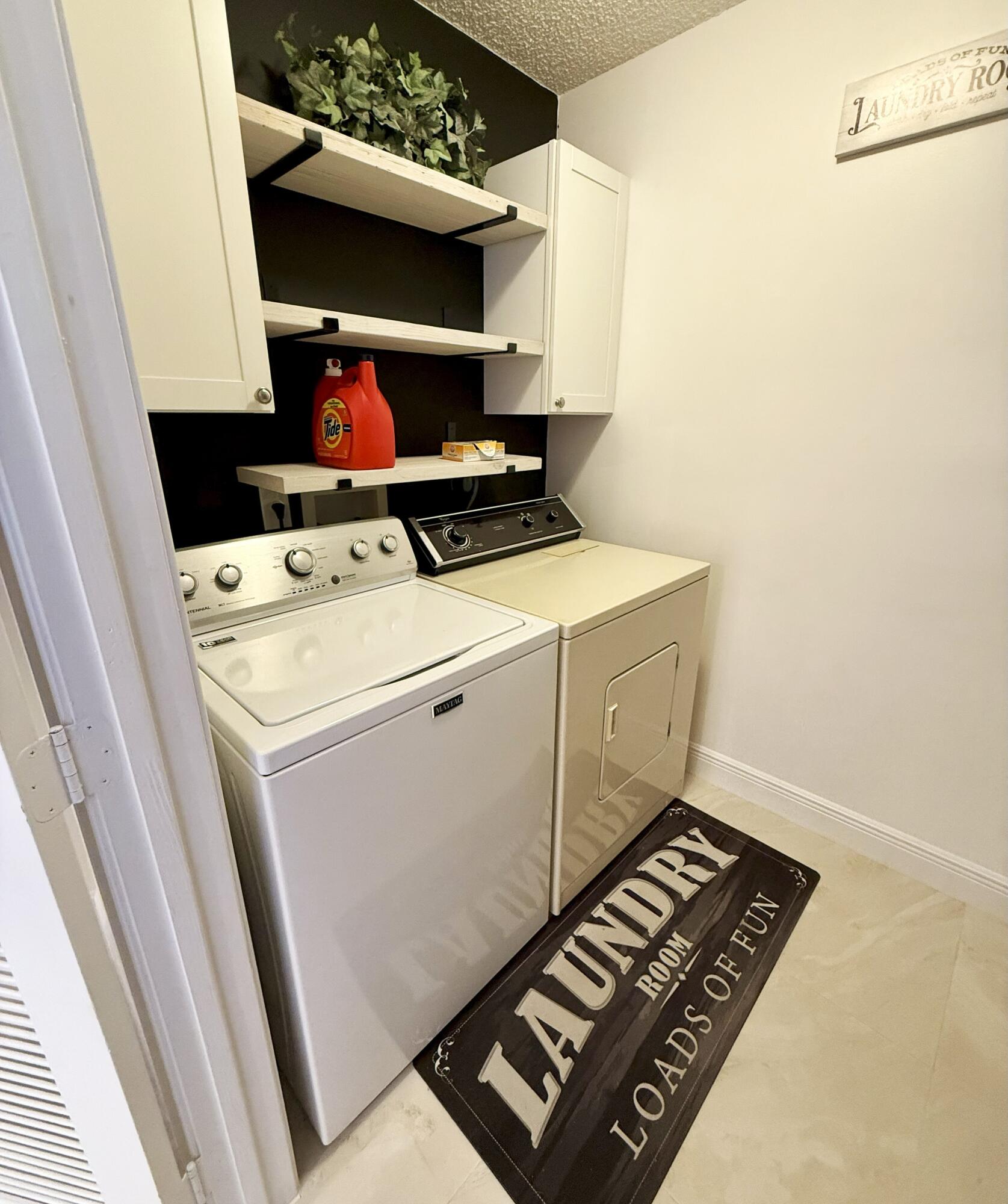 702 Wingfoot Drive, Unit D Jupiter, FL 33458 - Photo 12 of 39 Laundry Closet 1