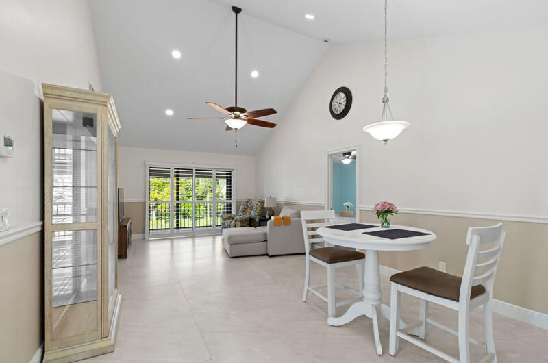 702 Wingfoot Drive, Unit D Jupiter, FL 33458 - Photo 14 of 39 Living-Dining rooms