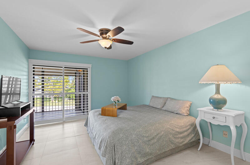 702 Wingfoot Drive, Unit D Jupiter, FL 33458 - Photo 21 of 39 Master Bedroom