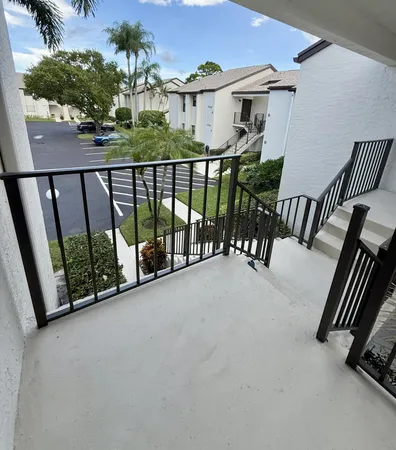 a view of a balcony with furniture
