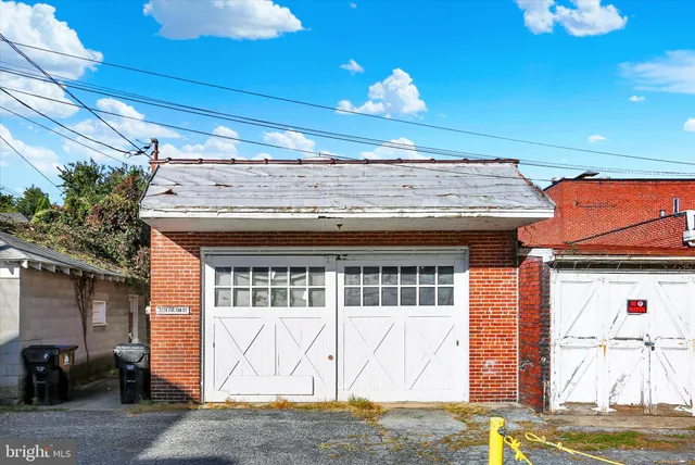 a view of a balcony with chairs and wooden floor