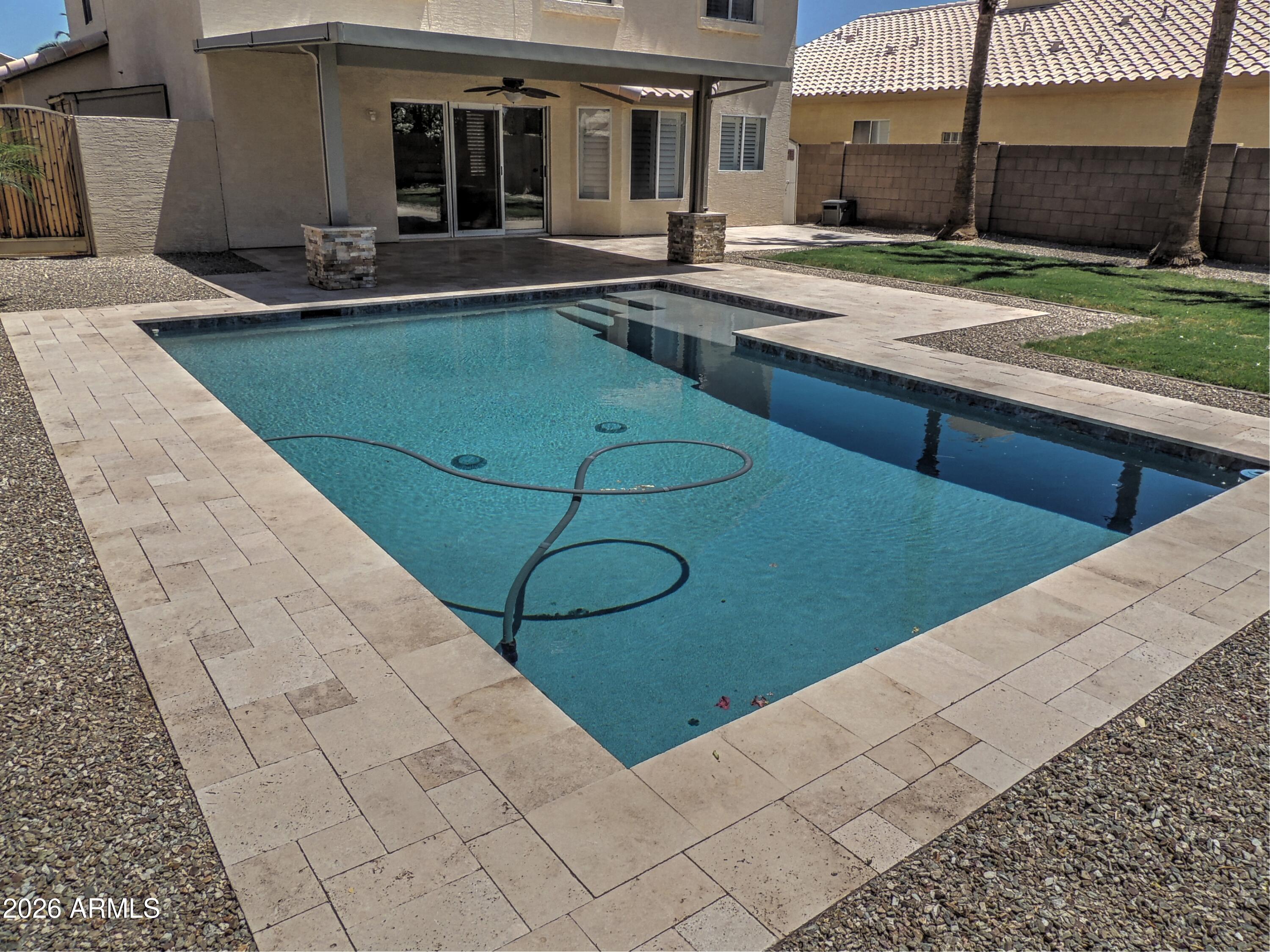 4409 East Dry Creek Road Phoenix, AZ 85044 - Photo 26 of 34 a swimming pool with outdoor seating