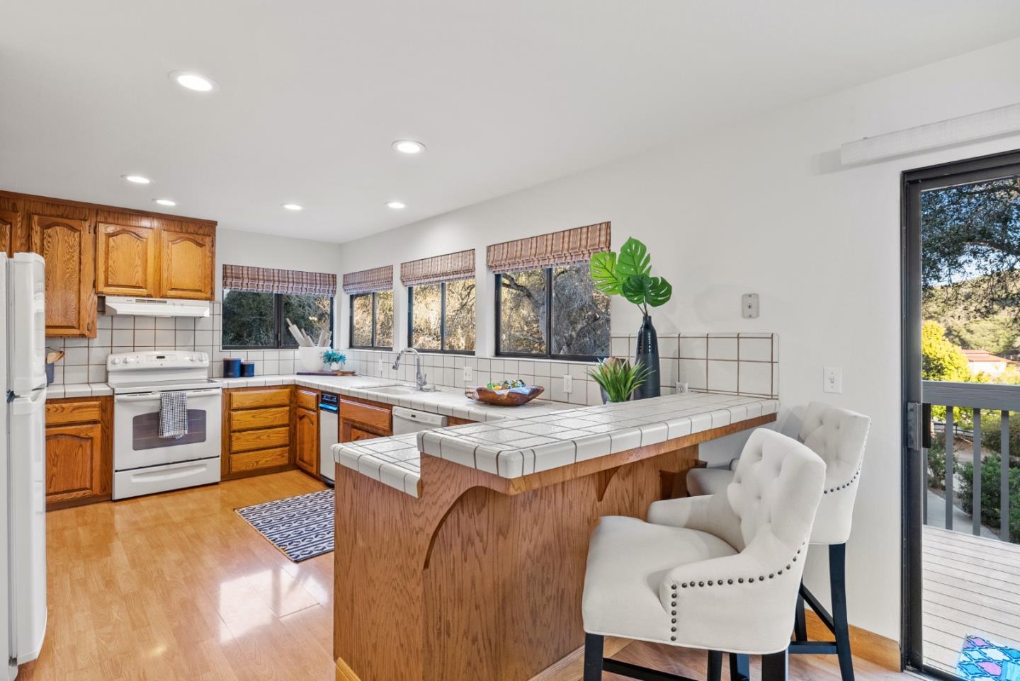 8935 Coker Road Salinas, CA 93907 - Photo 15 of 90 a large kitchen with stainless steel appliances granite countertop a stove a sink a dining table and chairs