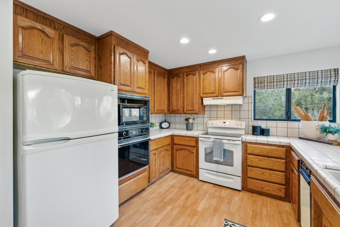 8935 Coker Road Salinas, CA 93907 - Photo 16 of 90 a kitchen with a refrigerator stove top oven and sink