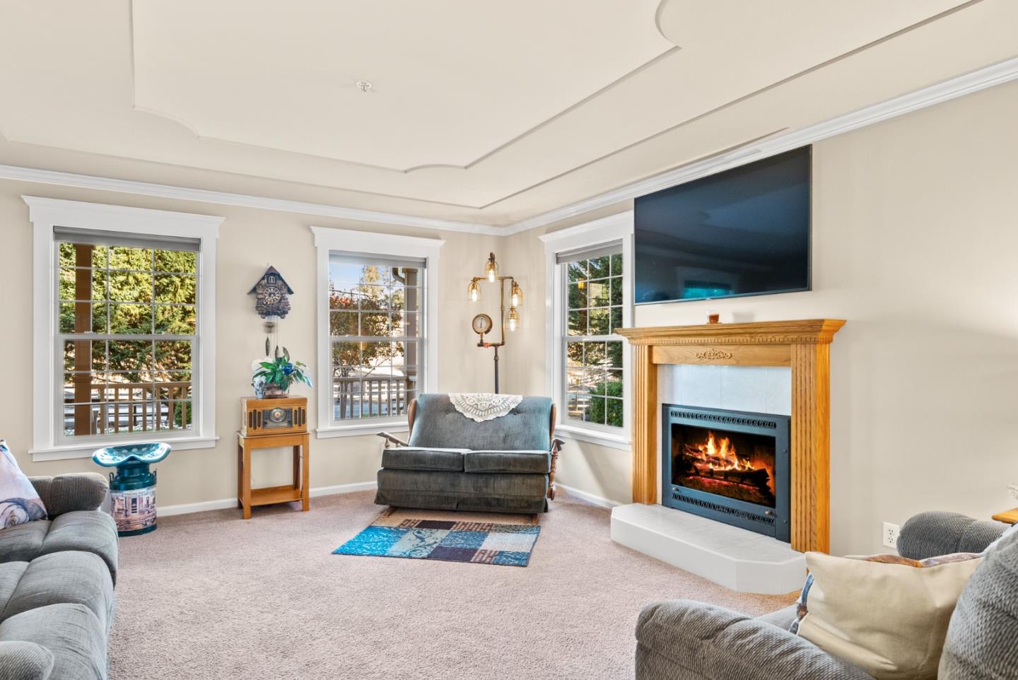 8935 Coker Road Salinas, CA 93907 - Photo 52 of 90 a living room with furniture a flat screen tv and a fireplace