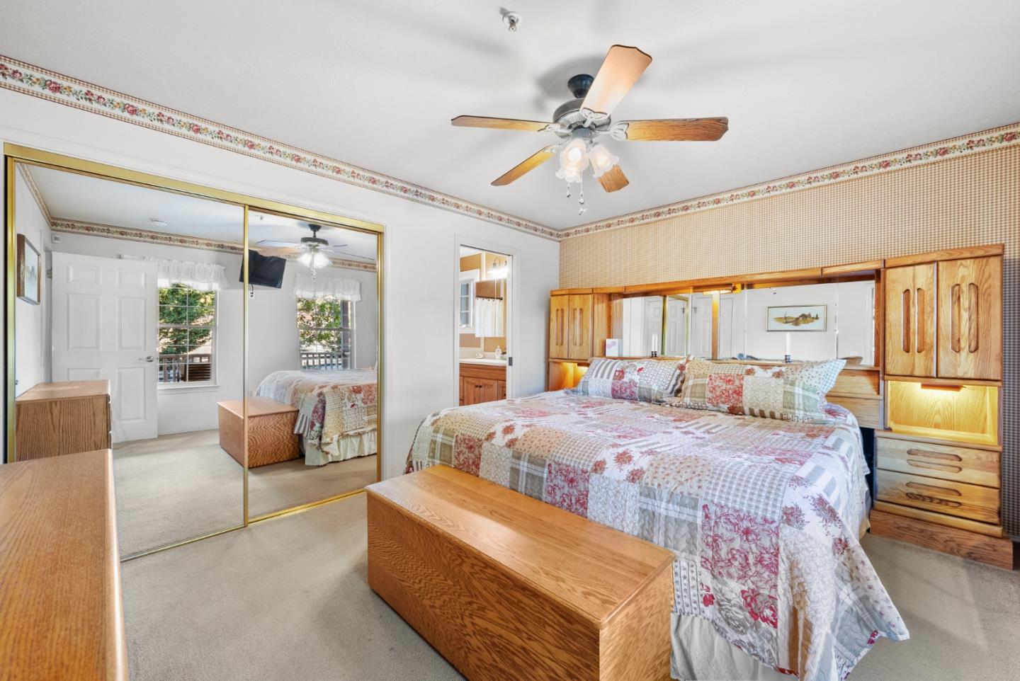 8935 Coker Road Salinas, CA 93907 - Photo 58 of 90 a bedroom with a large bed and a chandelier
