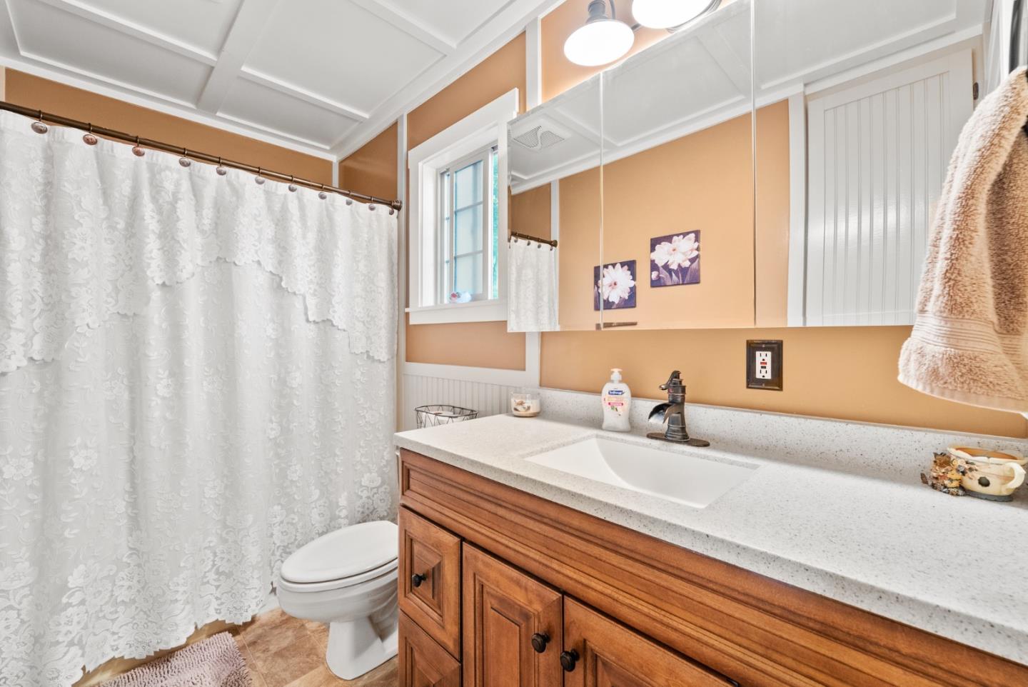 8935 Coker Road Salinas, CA 93907 - Photo 59 of 90 a bathroom with a sink a toilet and a mirror
