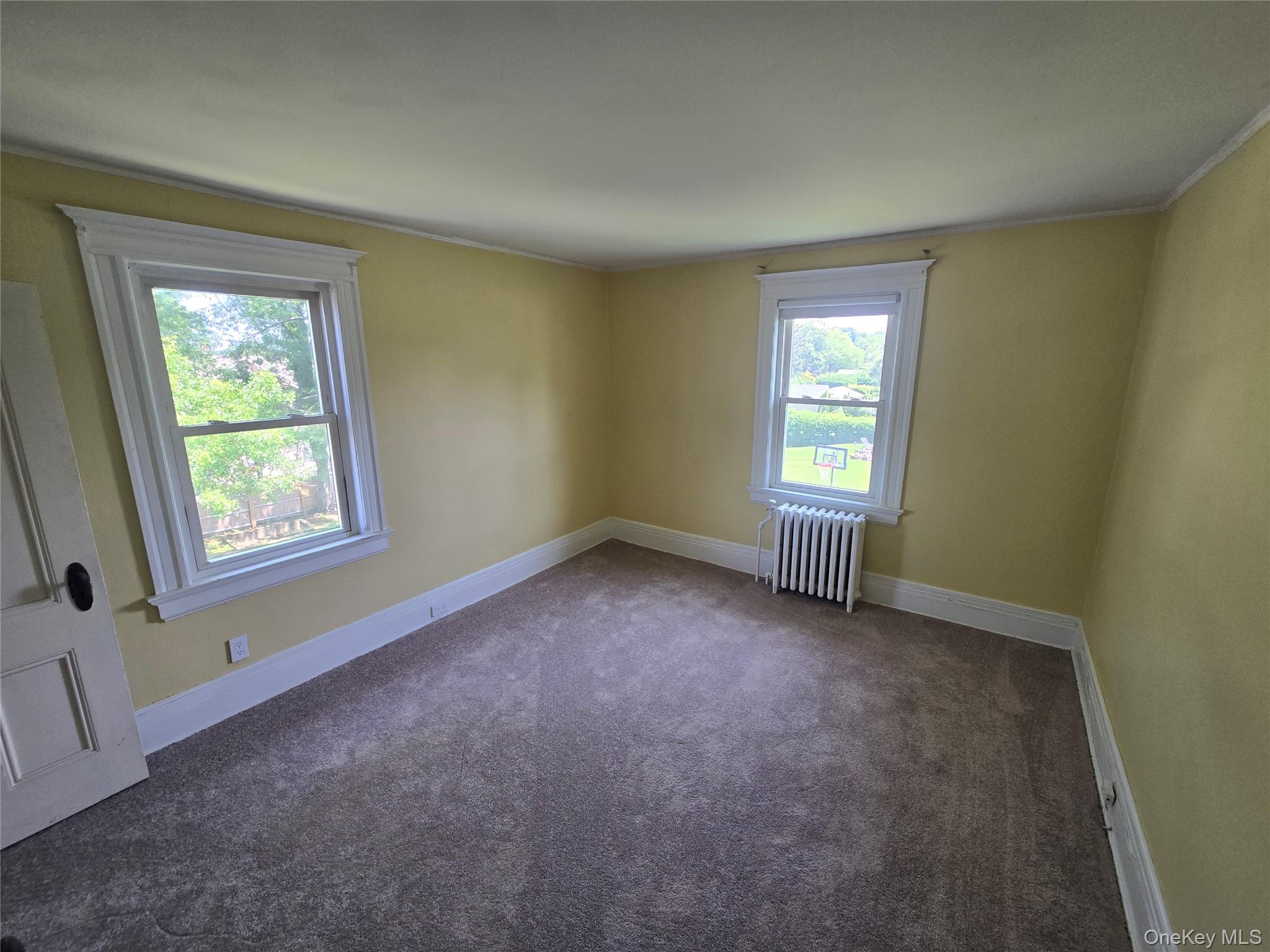 21-23 George Street Manhasset, NY 11030 - Photo 9 of 15 an empty room with windows