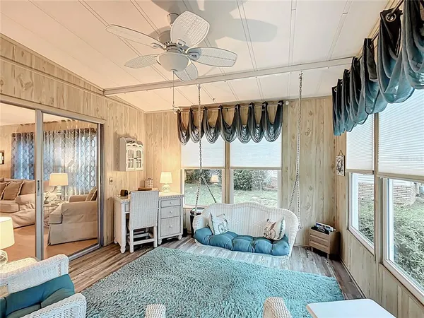 a living room with furniture a window and a rug