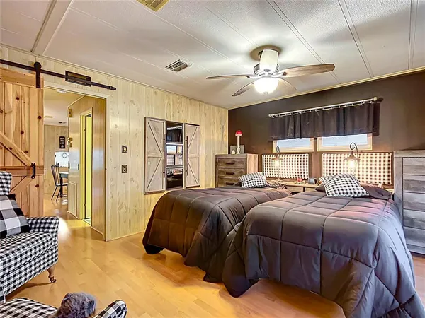 a bedroom with double bed and a window