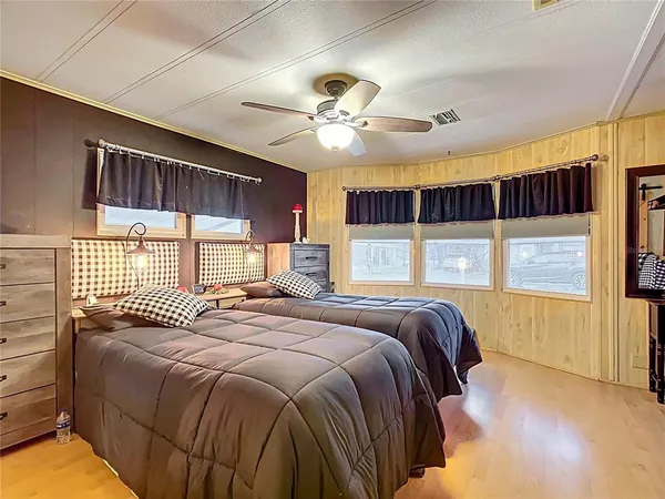 a bedroom with a large bed and a window