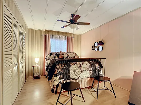 a view of a livingroom with furniture and a ceiling fan