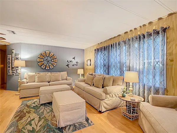 a living room with furniture and a table
