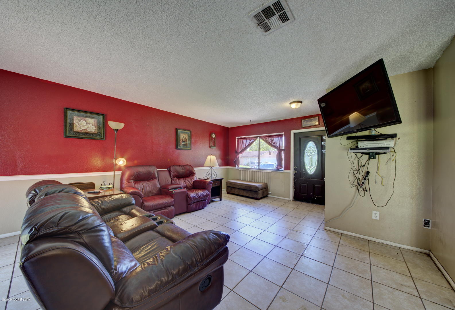 665 Weaver Road Southwest Palm Bay, FL 32908 - Photo 7 of 21 Living Room with Tile Floor