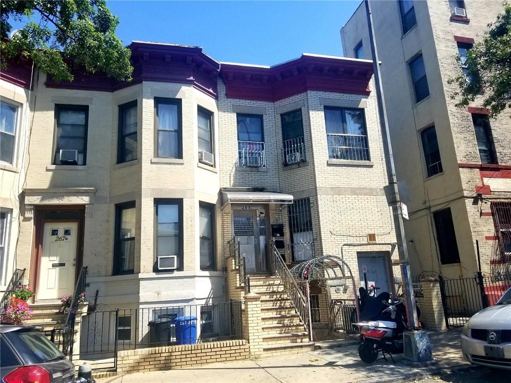 a front view of a building with street view