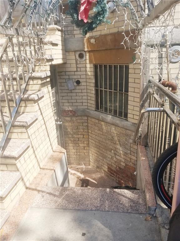 269 55th Street Brooklyn, NY 11220 - Photo 3 of 27 a view of a brick house with many windows