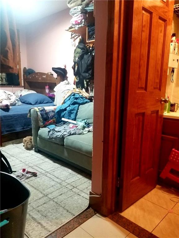 269 55th Street Brooklyn, NY 11220 - Photo 8 of 27 a living room with furniture and a rug