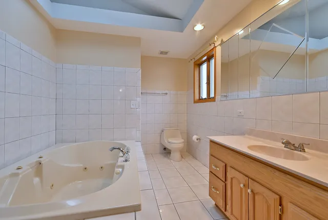 a bathroom with a sink a toilet and bathtub