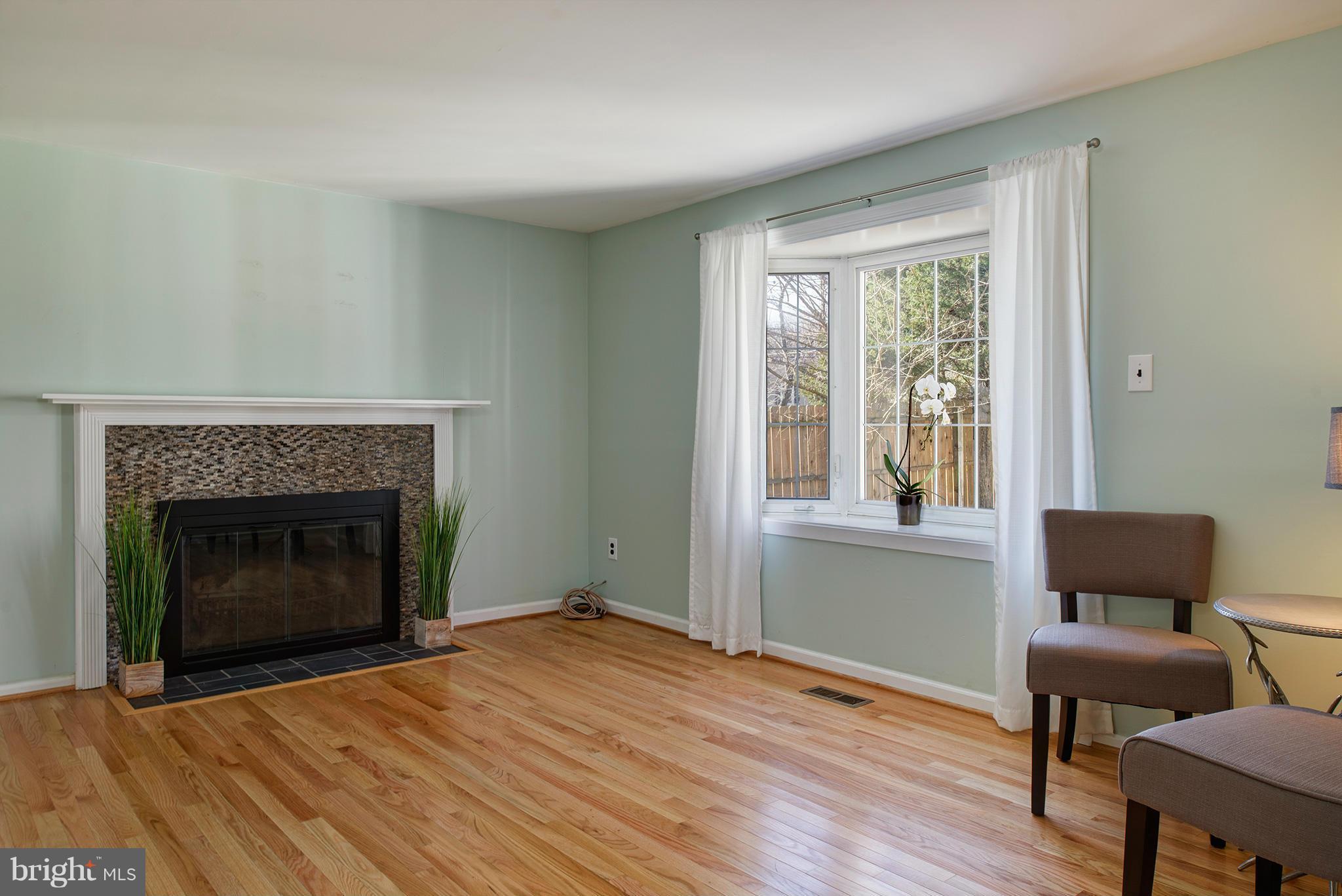 7610 Trail Run Road Falls Church, VA 22042 - Photo 3 of 29 Family Room w/ mosaic WB fireplace & new HWFs
