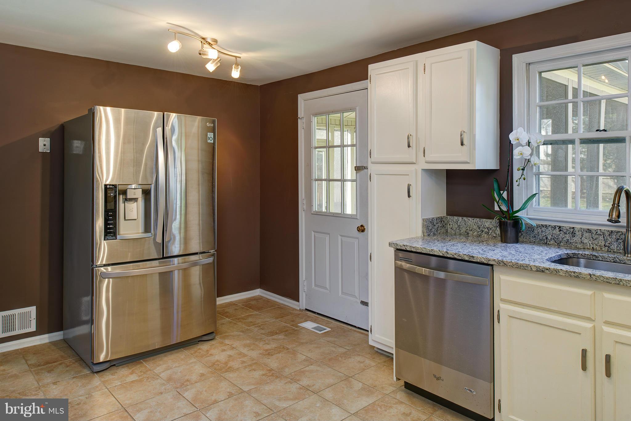 7610 Trail Run Road Falls Church, VA 22042 - Photo 10 of 29 Kitchen leads to porch & new flagstone patio