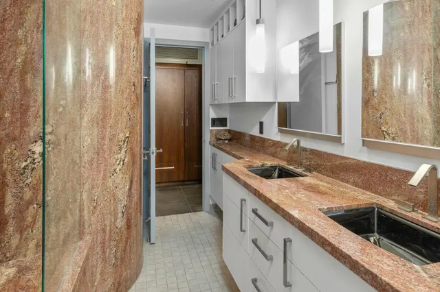 a kitchen with a sink and a refrigerator