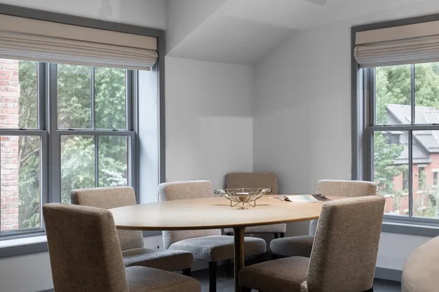 a view of a dining room with furniture window and outside view