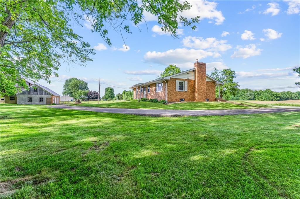 3205 Eastbrook Volant Road Volant, PA 16156 - Photo 23 of 29 a front view of a house with a yard