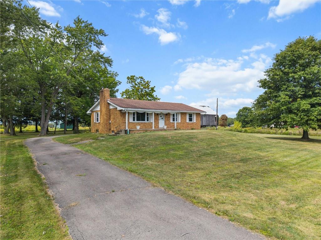 3205 Eastbrook Volant Road Volant, PA 16156 - Photo 3 of 29 a front view of house with yard and green space