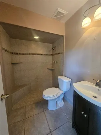 a bathroom with a toilet a sink and bathtub