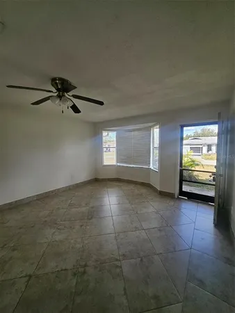 a view of an empty room with a window