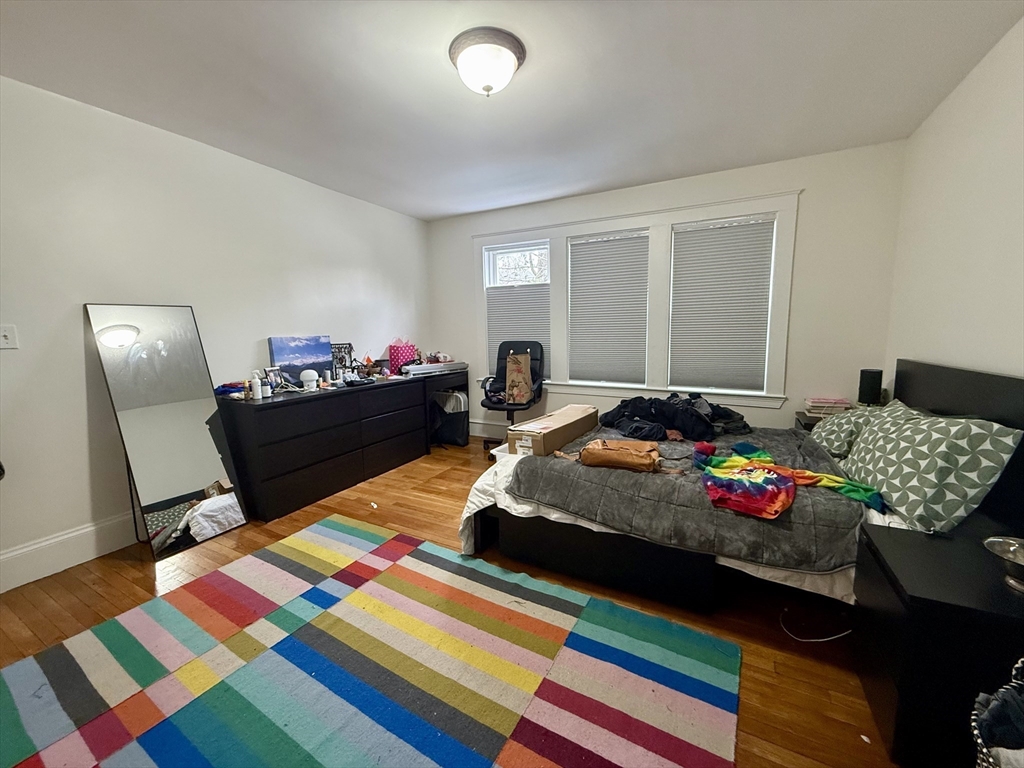 253 Brown Street, Unit 1 Waltham, MA 02453 - Photo 13 of 17 a bedroom with bed and a window