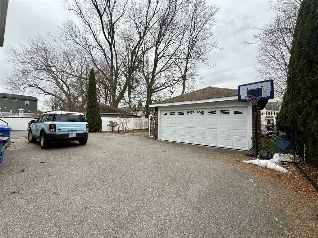 253 Brown Street, Unit 1 Waltham, MA 02453 - Photo 17 of 17 a view of a car parked in front of house