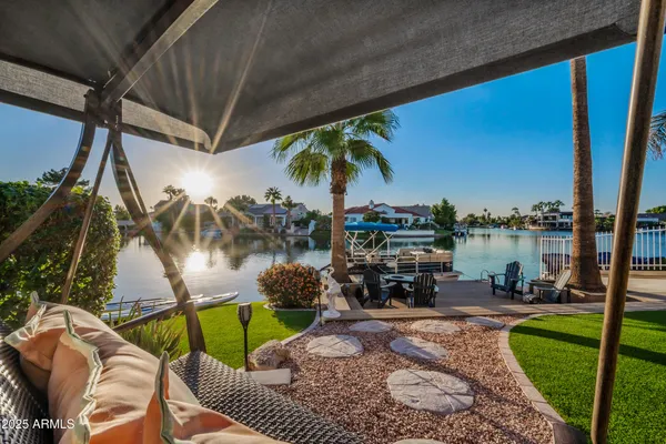 a view of a terrace with furniture and city view