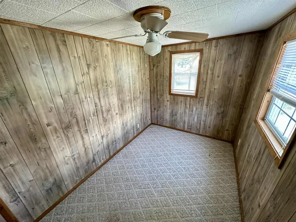 a view of a hallway with windows