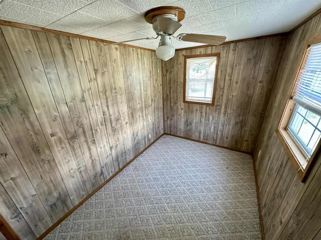 a view of a hallway with windows