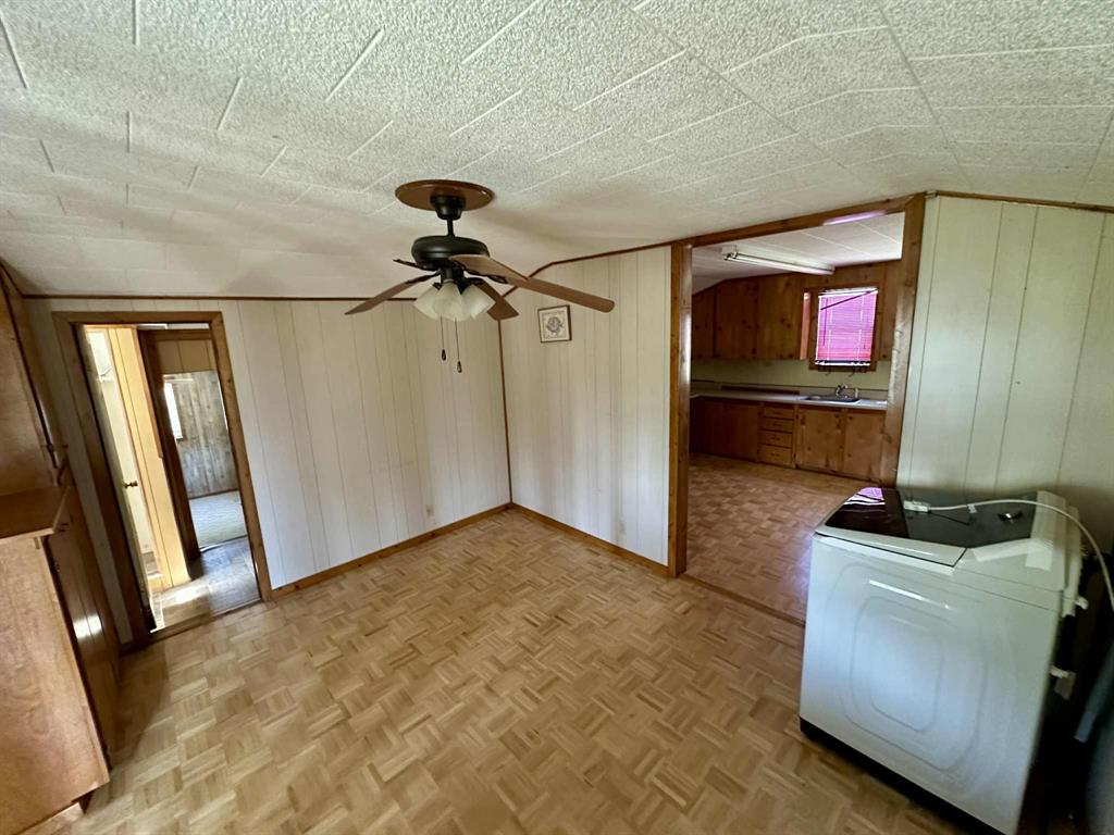 366 St Kitts Road Comanche, TX 76442 - Photo 13 of 20 a kitchen with a sink and a refrigerator