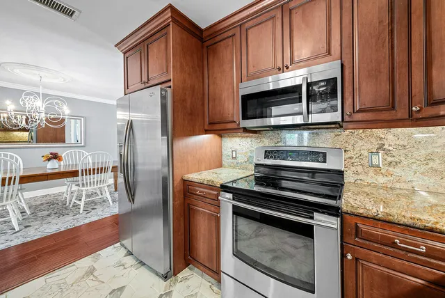 a bedroom with a bed and glass window