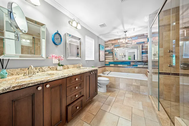 a bedroom with a bed window and a table with chair