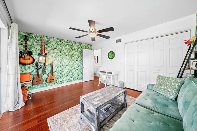 a bedroom with furniture and a book shelf