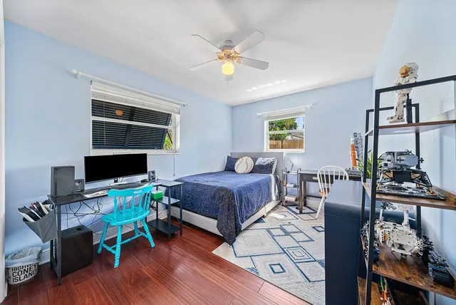 a bathroom with a sink toilet and a mirror