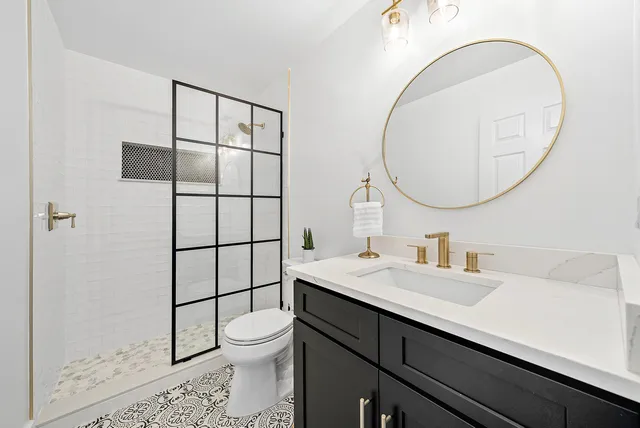 a living room with patio furniture and a floor to ceiling window